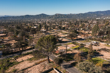 Drone view of empty lots of homes left behind from the Eaton fire, Pacific Palisades. January 2025, a series of 14 destructive wildfires affected the Los Angeles County in California, United States. © ShutterFalcon