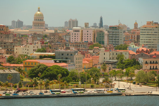 Cuba - Elevated view of Havana's waterfront, The Malecon and cityscape from Casa Blanca on a clear sunny day. El Capitolio can be seen prominently among colourful buildings across the bay
