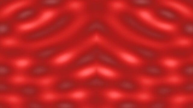 Abstract, blurred, symmetrical red pattern with light and dark areas suggesting a floral design