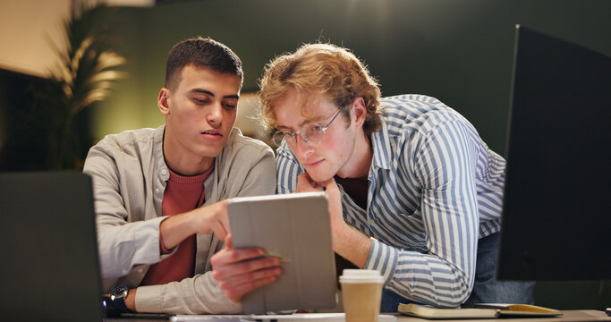 Night, creative and people in office with tablet, campaign review or discussion for digital marketing. Late, team and conversation with tech for planning, brainstorming or online advertising insight.