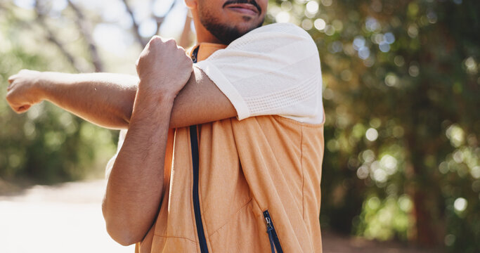 Outdoor, fitness and stretching with hands for hiking, warm up routine and prepare for trekking exercise. Getting ready, wellness practice and person with workout for health, nature training or bokeh