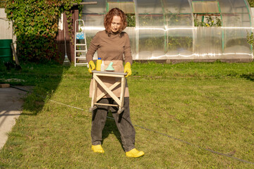 woman fertilizing apple tree