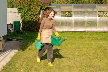 woman fertilizing apple tree