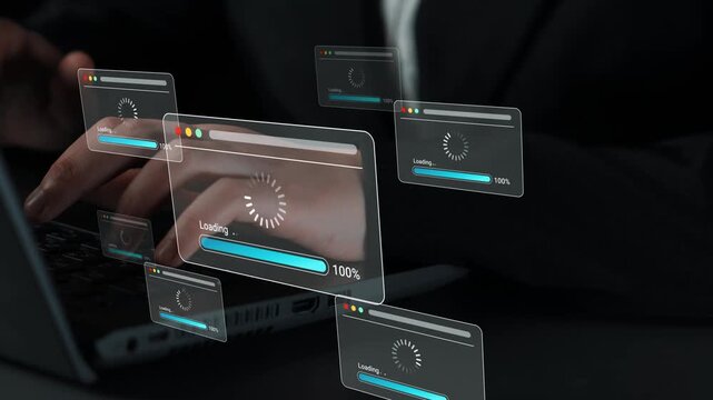 Hands Typing on Laptop with Animated Loading Screens Illustrating Digital Process and Technology in Modern Work Environment Gluon.