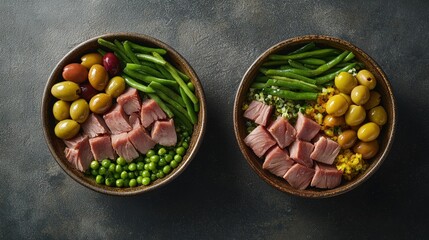 An overhead shot of a beautifully plated salad nicoise, featuring layers of tuna, olives, and green beans displayed in a rustic bowl. The vibrant hues of the fresh vegetables contrast against the