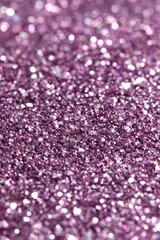 Sparkling Purple Glitter Surface Reflecting Light in Macro Shot Abstract Texture Background