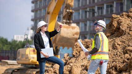 Engineer working Industrial pipeline system used for water supply or electrical cable protection large cylindrical pipes arranged in infrastructure underground utilities and public infrastructure.