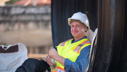 Engineer working Industrial pipeline system used for water supply or electrical cable protection large cylindrical pipes arranged in infrastructure underground utilities and public infrastructure.