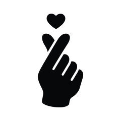 Obraz premium Silhouette of a hand with a heart above the index finger