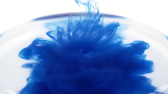 Deep Sea Ink Nebula Dark blue and black inks subtly bleeding into each other within a clear liquid, mimicking a cosmic nebula. A focused top light reveals the nuanced transitions and volumetric depth