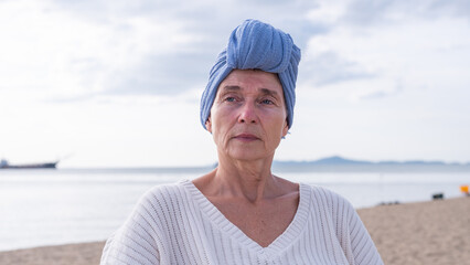Woman wearing a headscarf common symbol of strength among cancer patients undergoing treatment chemotherapy symbolizes the continuation of life and hope amidst adversity emotional strength.