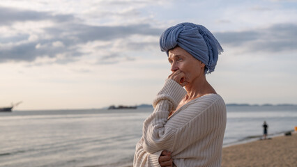 Woman wearing a headscarf common symbol of strength among cancer patients undergoing treatment chemotherapy symbolizes the continuation of life and hope amidst adversity emotional strength.