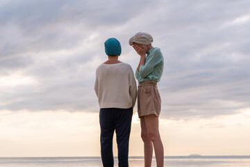 Moment friend support resilience and compassion, often associated with of battling cancer wearing a headscarf a common symbol of strength among cancer patients undergoing treatment.