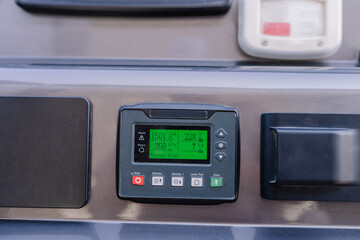 Digital control panel displaying temperature, pressure, and operational settings for industrial...