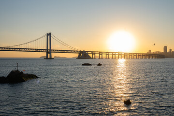 Fototapeta premium View of Xinghai Bay Bridge from Xinghai Square at Sunset in Dalian, China