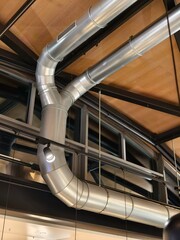 Naklejka premium Air conditioning ducts ventilation technology in a hall under a wooden ceiling