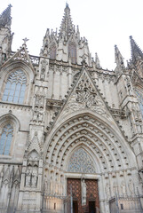 Fototapeta premium Detailed facade of the barcelona cathedral entrance, made on stone in gothic architectural style