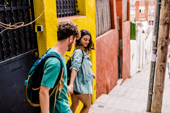 young tourists wallking by the city