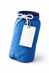 Swim shorts rolled into compact travel roll with drawstring tied and blank hang tag high key studio photo