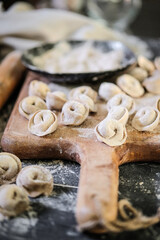 Fototapeta premium Artisan kitchen craftsmanship of tortellini with scattered flour