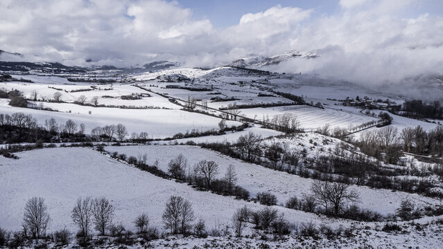 Snow-covered mountains and cloudy sky in the Pyrenees