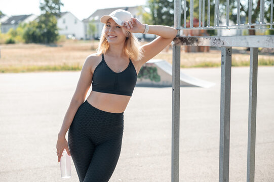 Woman In Sportswear At Skatepark