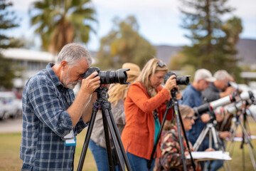 Group of photographers capturing images outdoors