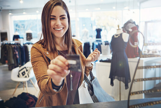 Smile, woman and shopping with credit card in store for clothing purchase, payment and retail sale. Happy, female person and customer with pos for checkout, rewards program and discount in boutique