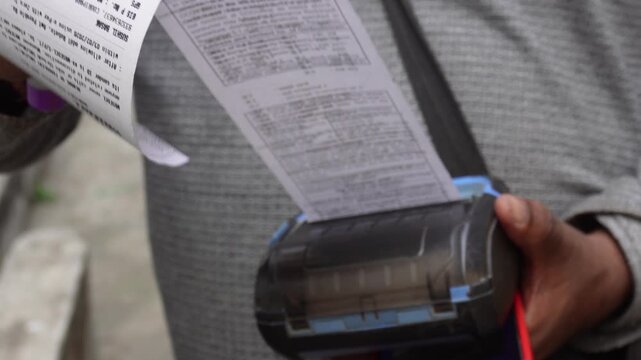 Persons generate electricity bills using portable thermal printers