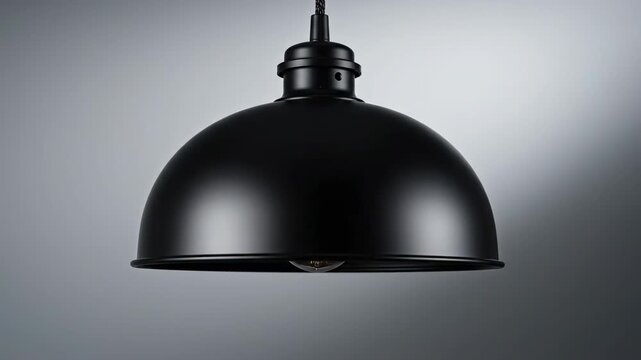 Isolated minimalist slow rotation of a clean black industrial dome pendant lamp against a smooth gradient background suitable for product display or catalog use ecommerce, technology, objectanimation