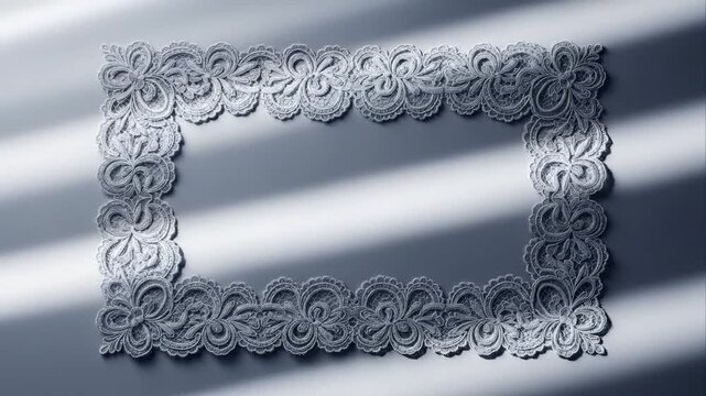 Elegant floral lace frame on white surface with dramatic light and shadow