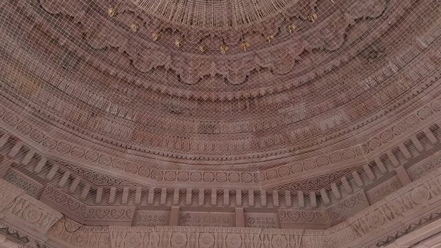 Shri Valinath Mahadev Mandir dome interior in Gujarat India showing carved stone ceiling, chandelier light, ornate Hindu temple architecture, spiritual atmosphere, heritage craftsmanship and sacred de