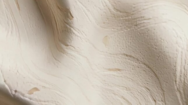 Elegant white marble texture with wavy patterns and subtle beige tones