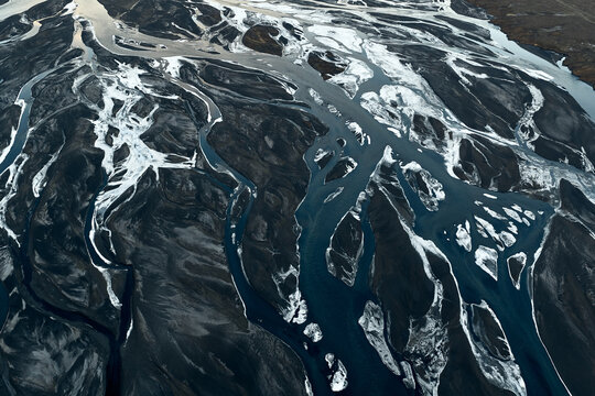 Braided glacier river channels creating abstract terrestrial patterns