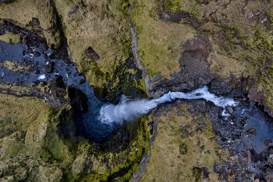 &Iacute;rafoss waterfall cascading into natural pool in iceland