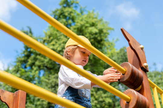 A little boy at a playground. Happy childhood.