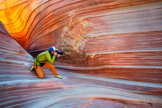 Photographer exploring The Wave in Coyote Buttes North