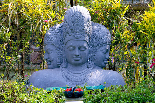 hindu god trimurti statue in the garden