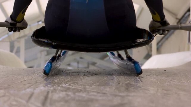 Luge athlete and sled at the starting line