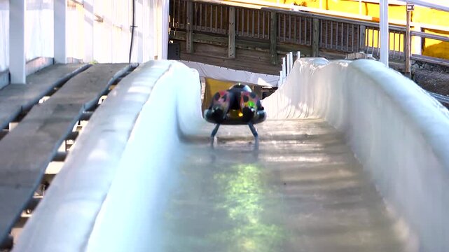 Luge athlete sliding down the track