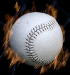 Baseball Surrounded by Flames on Dark Background