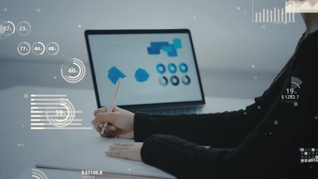 デスクで勉強する女性と統計データのコンセプト