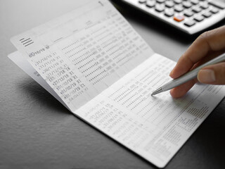 Obraz premium Bank account book statement balance number cash, data investment debt math in office, bill receipt and payment business credit card account, check paper financial loan tax concept.