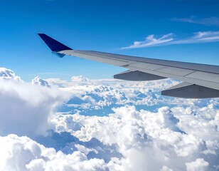 Obraz premium Aerial view of an airplane wing soaring through clouds