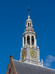 Fototapeta premium Old Church Tower with Clock and Belfry in Maassluis