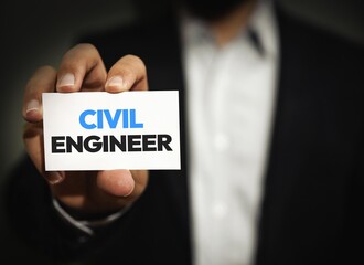 Civil engineer business card held by suited professional highlighting engineering career and corporate identity