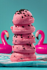 Stacked watermelon ice cream slices with playful summer pool background and flamingos