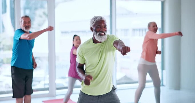 Boxing, fitness and class with old man in studio for mobility workout, health and joint friendly exercise. Wellness, learning and senior training group with people in club for cardio and hobby