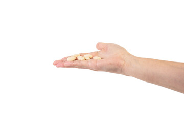 Medicine or vitamins in hand on transparent background