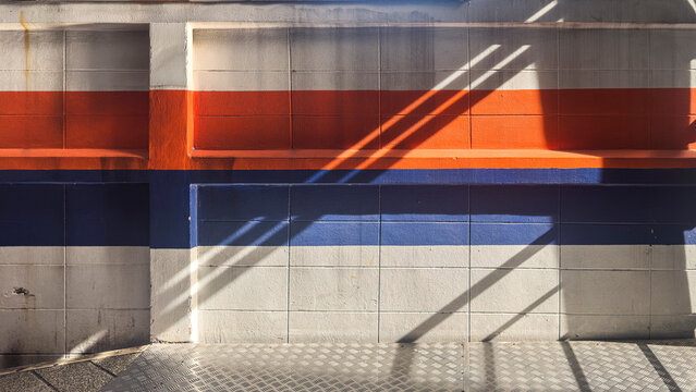 Modern Architecture Detail: Color Block Wall with Dramatic Diagonal Shadows